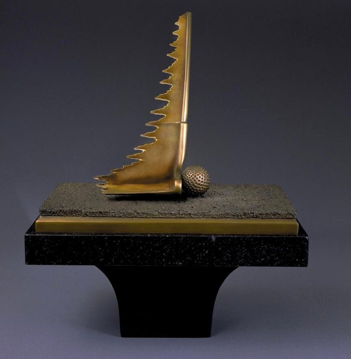 &ldquo;Make It&rdquo; bronze golf sculpture on a black granite pedestal